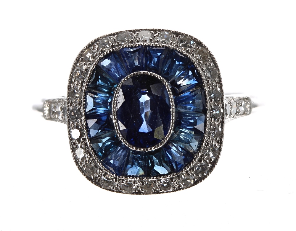 Platinum sapphire and diamond ring, set with an oval central sapphire, 0.62ct approx, a halo setting - Image 2 of 2