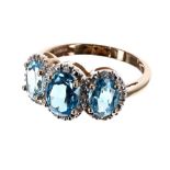 9ct blue topaz and diamond triple cluster ring, the cluster 10mm x 19mm, 3.4gm, ring size P