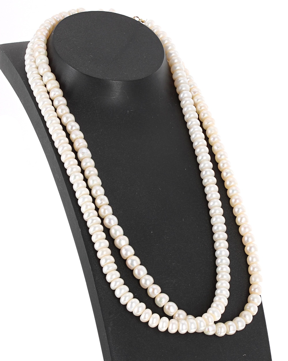 Two strings of graduated cultured pearls necklaces, the pearls graduating from 6mmm to 7mm, each 16"