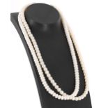 Two strings of graduated cultured pearls necklaces, the pearls graduating from 6mmm to 7mm, each 16"