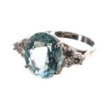 Impressive 18ct white gold aquamarine and diamond ring, the oval aquamarine 6.65ct approx, flanked