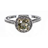 Attractive GIA certified 18ct white gold diamond halo dress ring, set with a central natural