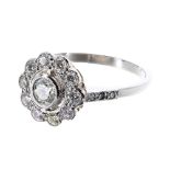Platinum diamond cluster ring with set shoulders, 0.75ct approx, 11.5mm, 4.6gm, ring size O