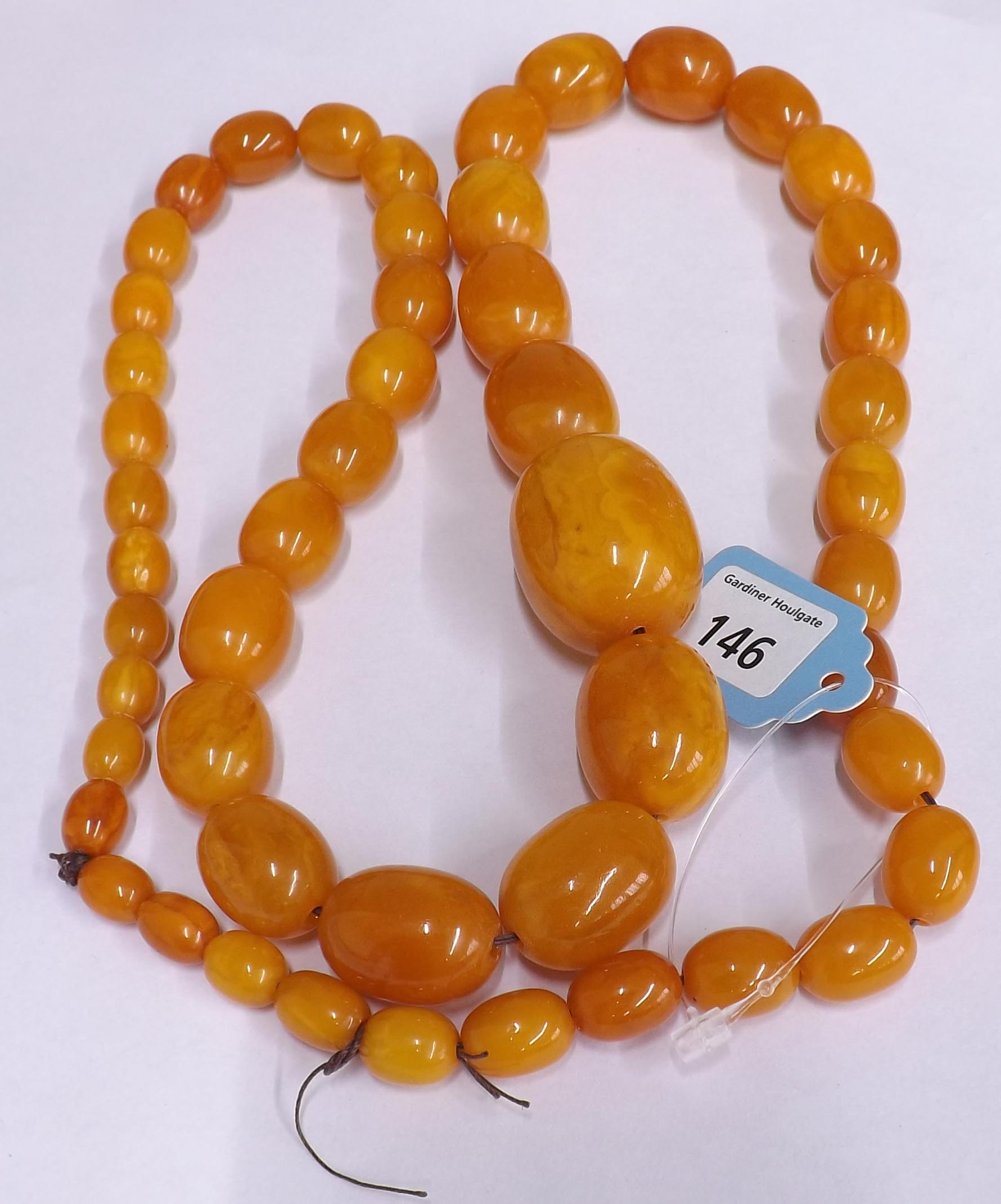 Graduated butterscotch amber bead necklace, consisting of 51 beads, 99.3gm, 10mm- 33mm, 30" long - Image 7 of 7