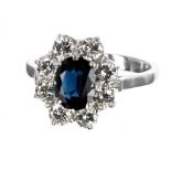 Good quality platinum sapphire and diamond cluster ring, the sapphire 1.30ct approx, in a surround