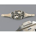 Vintage Scandinavian silver brooch of scroll and floral form, marked 'Haandarbejde KKK 830S', 2.5"