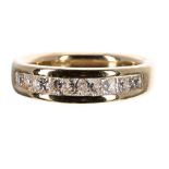 18ct yellow gold band ring set with nine princess-cut diamonds, 0.73ct approx, clarity VS2-SI,