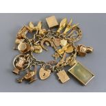 Good 9ct charm bracelet with padlock clasp, safety chain and twenty-seven charms (twenty-three