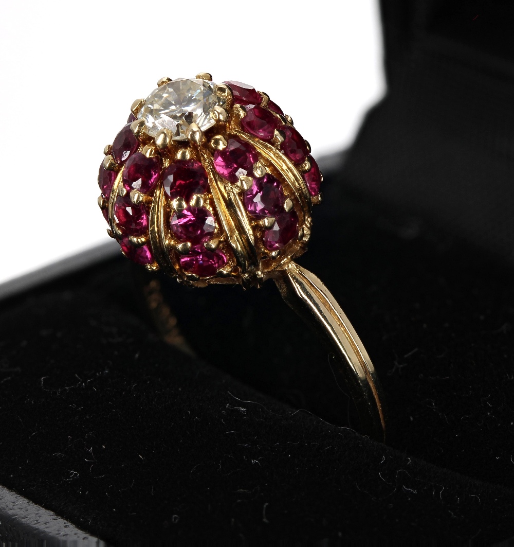 18ct domed ruby and diamond cluster ring, the diamond 0.50ct approx, clarity VS, colour J-K, in a