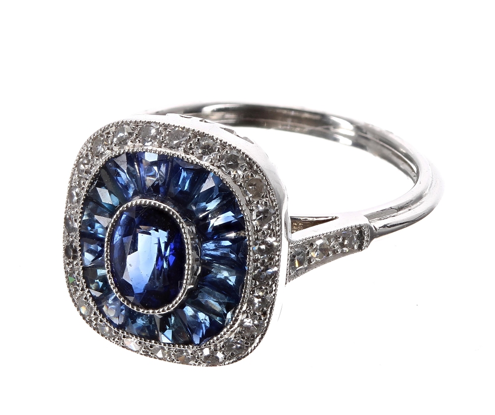 Platinum sapphire and diamond ring, set with an oval central sapphire, 0.62ct approx, a halo setting