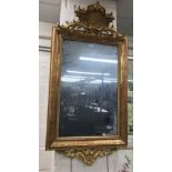 Good George II style wall mirror, the simulated aged plate within a gilded floral scratch carved