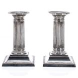 Pair of William Hutton & Sons Ltd silver candlesticks of Corinthian column form, on square stepped