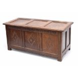 18th century oak carved panelled coffer, the triple panelled moulded top enclosing open interior,