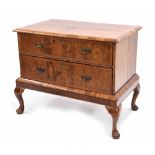 18th century style burr walnut veneered chest on stand, the crossbanded top over two long drawers,