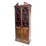 George III Hepplewhite period mahogany bookcase on cabinet, the moulded cornice surmounted