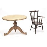 CIrcular pine breakfast table, the moulded top on turned support raised on three cabriole legs,