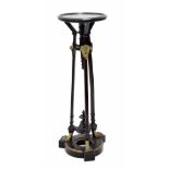Aesthetic Movement ebonised and gilt metal torchere, the circular moulded top over three square legs