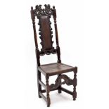 William & Mary and later oak high-backed side chair, the cresting rail carved with two mythical