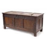 Part-Charles I oak coffer, the quadruple raised panelled top with moulded edge opening to reveal a