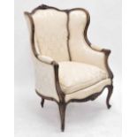 19th century French walnut fauteuil, with floral damask cream upholstery, within a carved and fluted