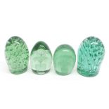 Four Nailsea type green glass dumps, the largest 5" high (4)