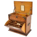 Edwardian oak brass mounted mahogany stationery box, the hinge lid and fall front enclosing a