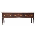 George III oak and walnut crossbanded low dresser, the moulded planked top over three mahogany