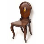 Victorian mahogany hall chair, the oval panelled back painted with a family crest over a solid