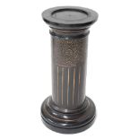 Aesthetic Movement circular ebonised and gilded pedestal torchere, the top 13" diameter, 29" high
