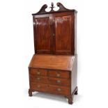 George III mahogany bureau cabinet, with two panelled cupboard doors enclosing a shelved interior