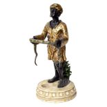 Reproduction resin painted resin stick stand, modelled with a figure holding a snake upon a circular