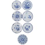 Collection of seven Chinese porcelain blue and white plates and shallow bowl, 18th century, the