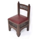 Liberty style single low chair in the Moorish manner, with a red leatherette studded seat, 16" wide,