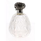 Edward VII silver mount glass scent bottle, the repousse scrolling decorated hinged cover over an