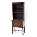 Early 20th century mahogany three tier open bookcase, over a cupboard with two doors applied with