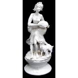 Large blanc de chine style white glazed porcelain figure of a Shepherdess with basket of fruit, a