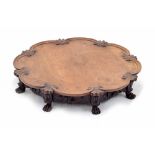 Chinese carved hardwood circular shaped Lazy Susan, the scrolling bordered top carved with feather