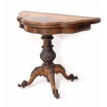 Victorian walnut serpentine fold-over games table, the games surface red baize lined, upon a leaf