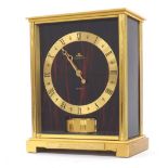 Good Jaeger LeCoultre 'Embassy Red' model Atmos clock, the 5" gilt brass chapter ring with faux