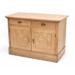 Pine cupboard with parquetry panelled doors, the shaped top over two short drawer and two cupboard