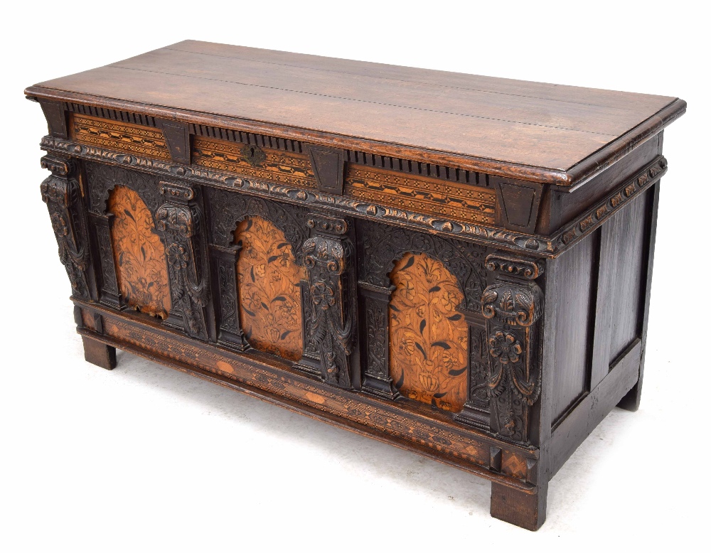 Rare Elizabeth I and later oak inlaid coffer, the planked moulded top opening to reveal a candle box