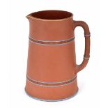 Watcombe Pottery type terracotta jug designed by Christopher Dresser, with glazed turquoise bands to