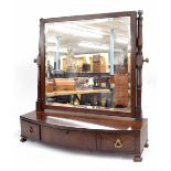 Regency mahogany toilet mirror, supported upon baluster turned columns over a bow front base of