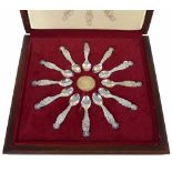 Cased set of twelve commemorative silver Apostle spoons, each spoon with inset gilt medallion to the