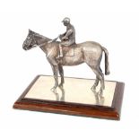 Wakely & Wheeler good quality cast silver horse and rider model, London 1994, upon a rectangle