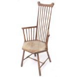 Godwinesque comb back chair, with an hexagonal solid seat upon cylindrical tapered supports, the