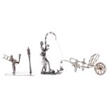 Silver miniatures to include silver wheel barrow, 3" long; novelty silver figure of a fisherman