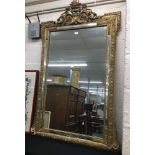 Large impressive Victorian overmantel mirror, within a foliate moulded frame surmounted by a pierced