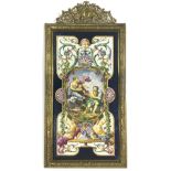 Decorative Continental Maiolica plaque within an ornate cast gilt metal frame, painted with