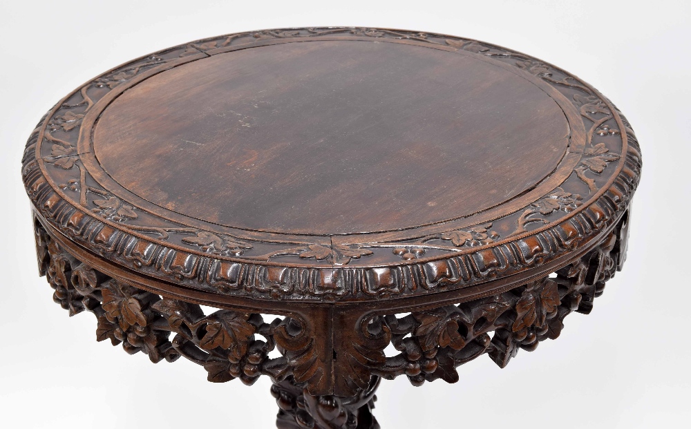 Chinese hardwood circular occasional table, the top carved with a continuous band of fruiting - Image 2 of 3